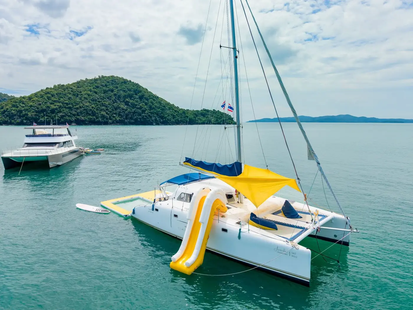 Private yacht at anchor on calm blue water
