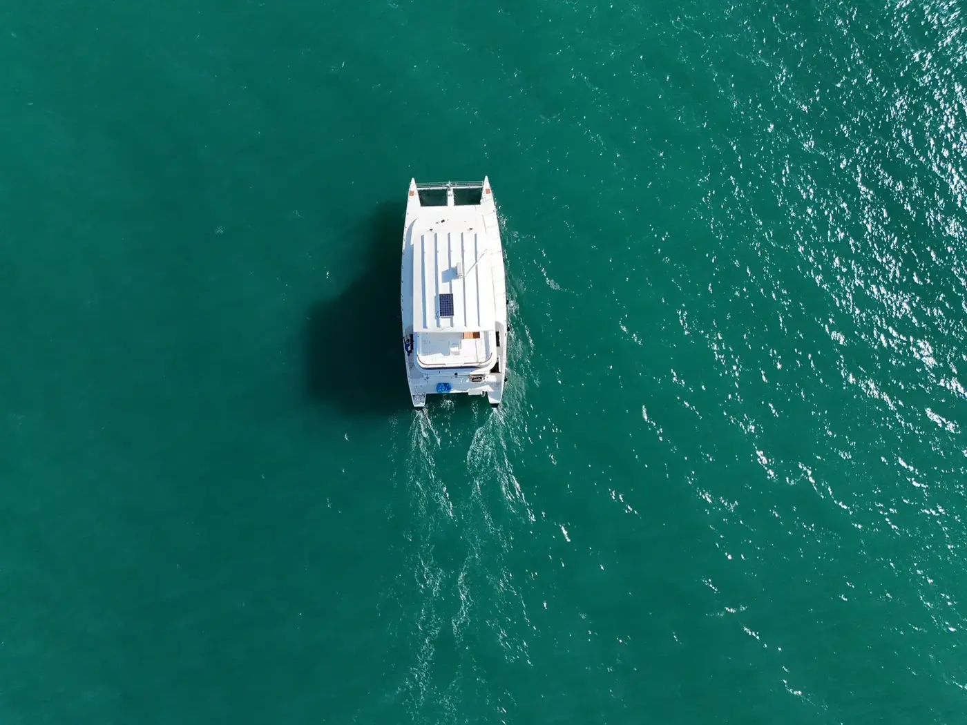 Nerita, a 57 ft power catamaran seen from above on open water